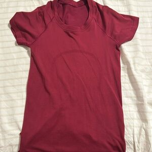 Pink/red lulu Swiftly Tech, Size 2. Great condition.